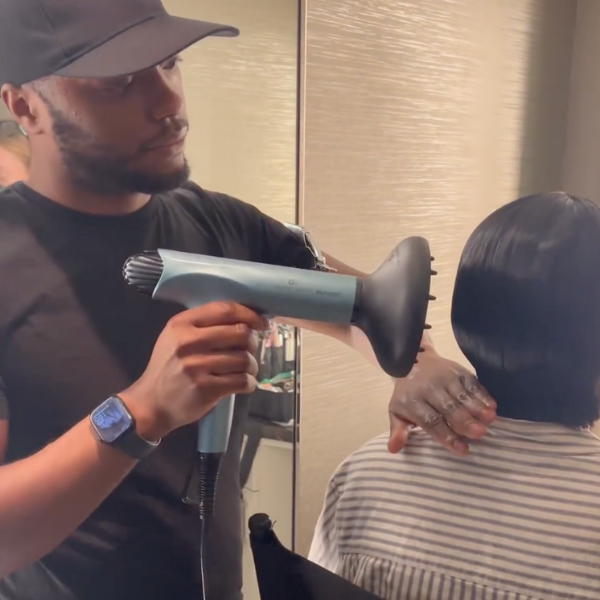 Ro Morgan styling Ayo Edebiri's hair with Olivia Garden diffuser