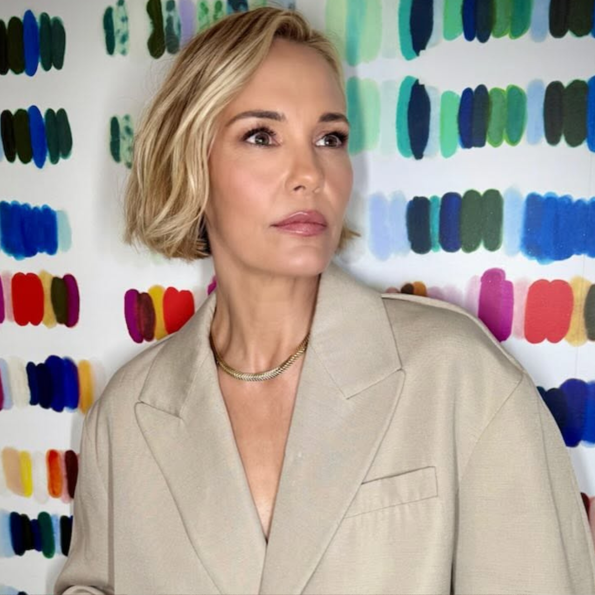 Leslie Bibb in a cropped blazer with her Old Money blonde bob styled sleek and polished