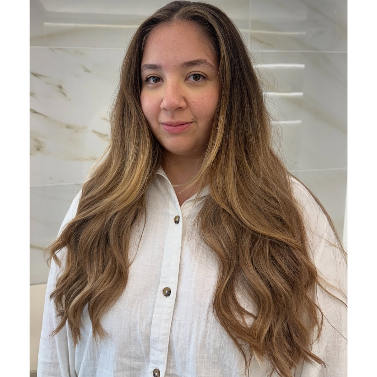 Grown out warm brunette color on a model with long hair