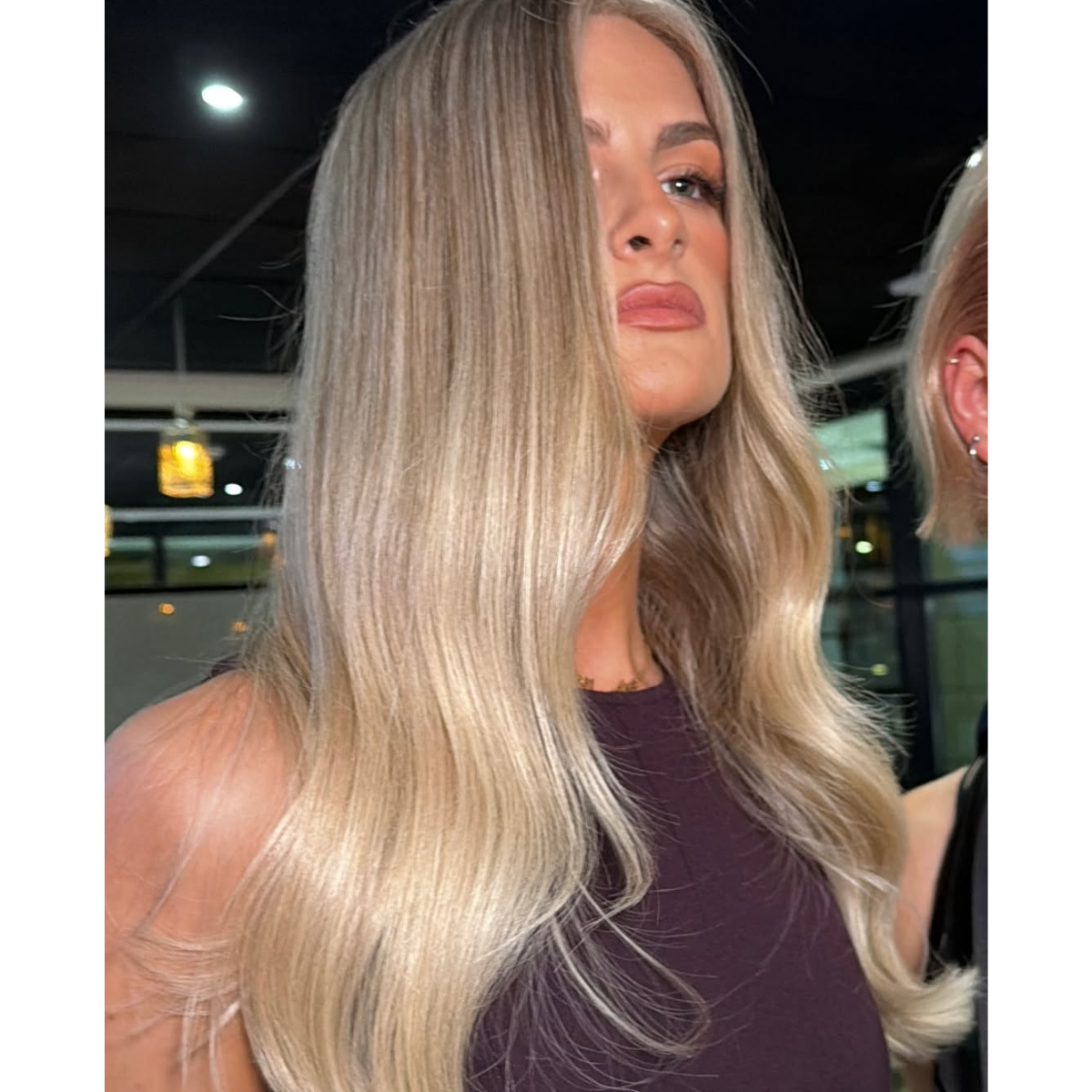 glossy luminous Pearl blonde hair with soft waves