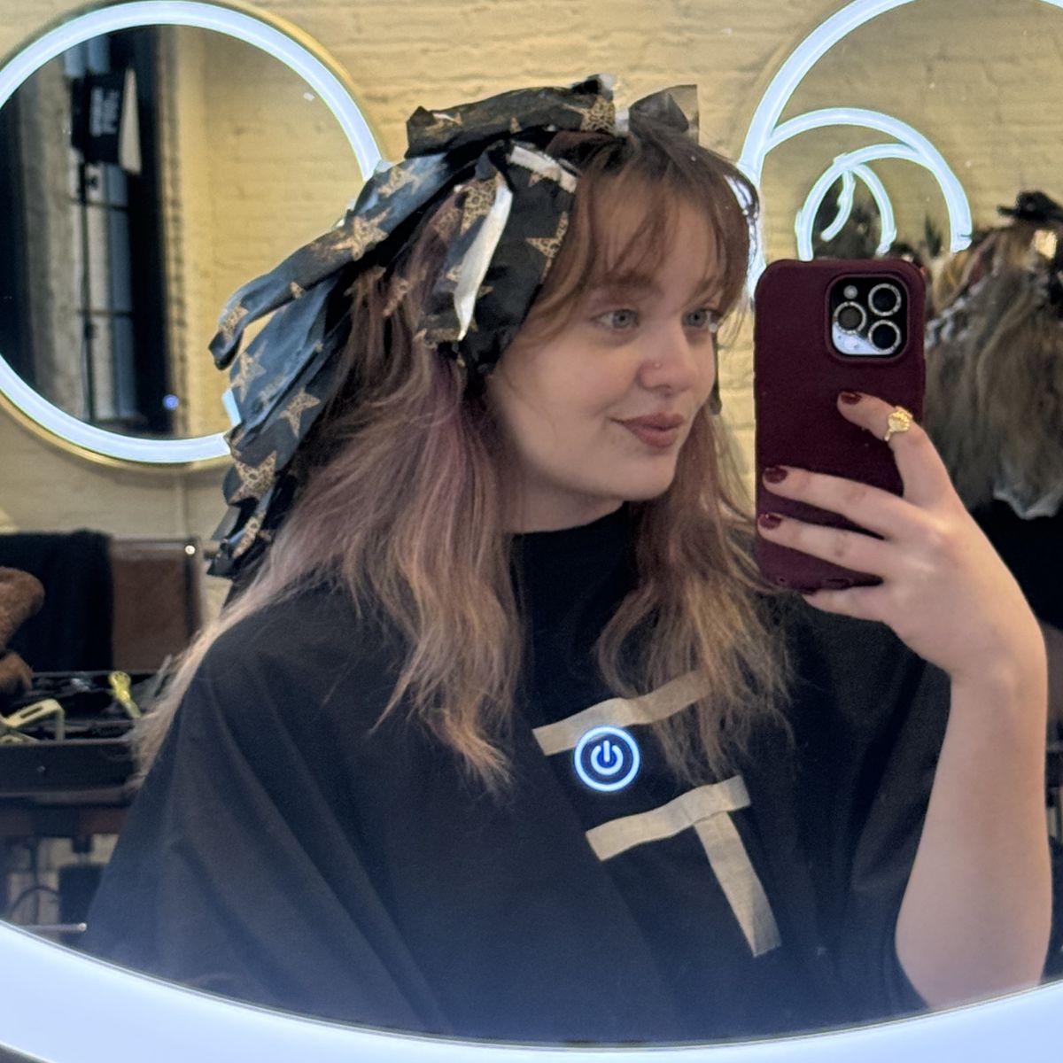 Client processing with foils throughout the hair during a dimensional color service.