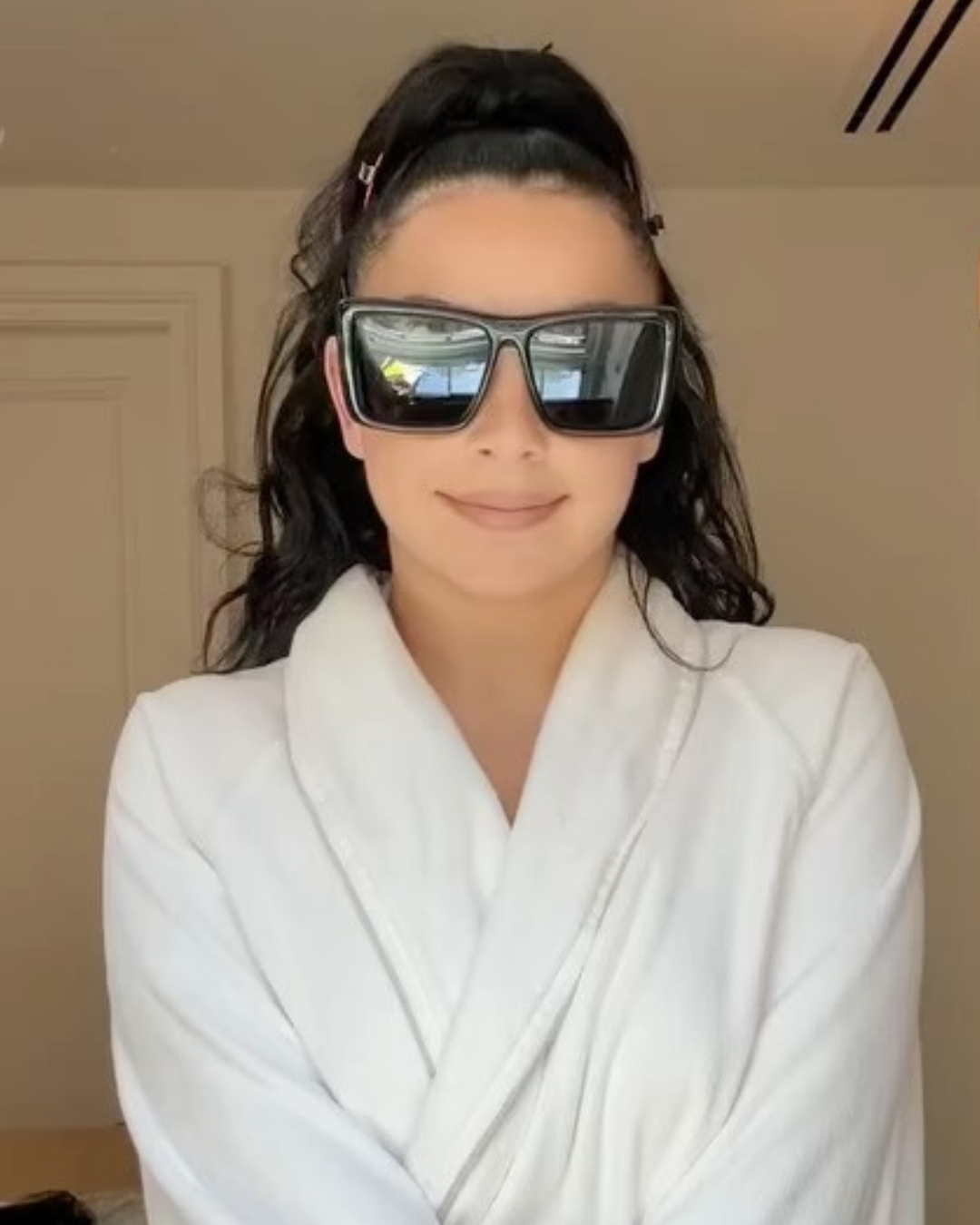 Charli XCX in a white robe glossy black hair front view Photo Credit Instagram via @mattbens